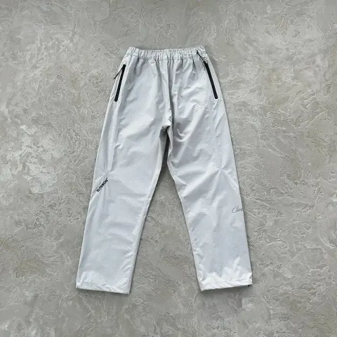 Corteiz Pink Windbreaker with Monogram on Sleeves option Grey pants