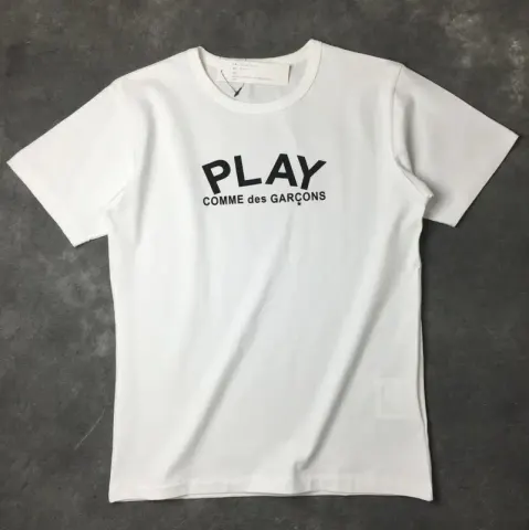 CDG T-Shirts option White with a black heart behind it