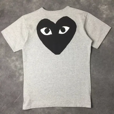 CDG T-Shirts option Grey with a black heart behind it